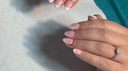 French manicure nails at Ashley @ The Beauty House, LEVEN, Scotland, GB, showcasing delicate pink and white tips.