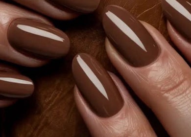 Glossy brown manicured nails at Riri Beauty Clinic, Brighton And Hove, England, GB.