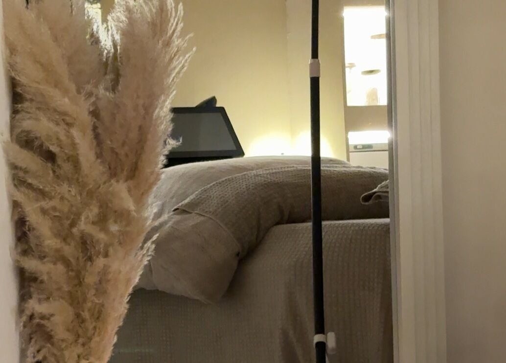 Tranquil space at E Elegance & Co. in Paisley, Scotland, GB featuring a soft bed and warm lighting.