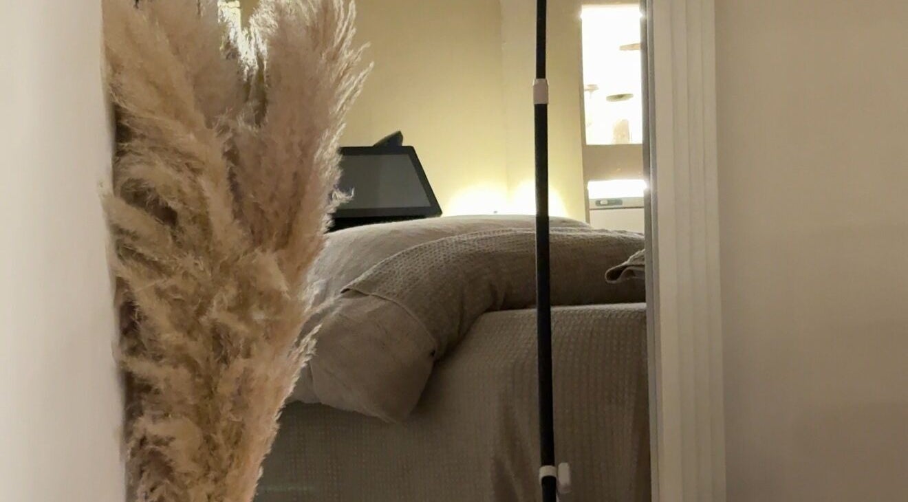 Tranquil space at E Elegance & Co. in Paisley, Scotland, GB featuring a soft bed and warm lighting.