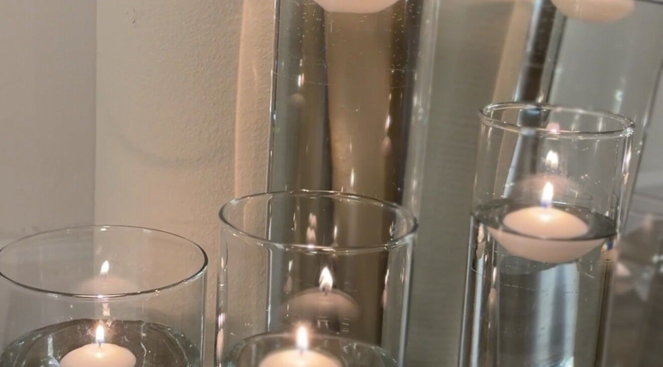 Floating candles create serene ambiance at E Elegance & Co., Paisley, Scotland, GB.