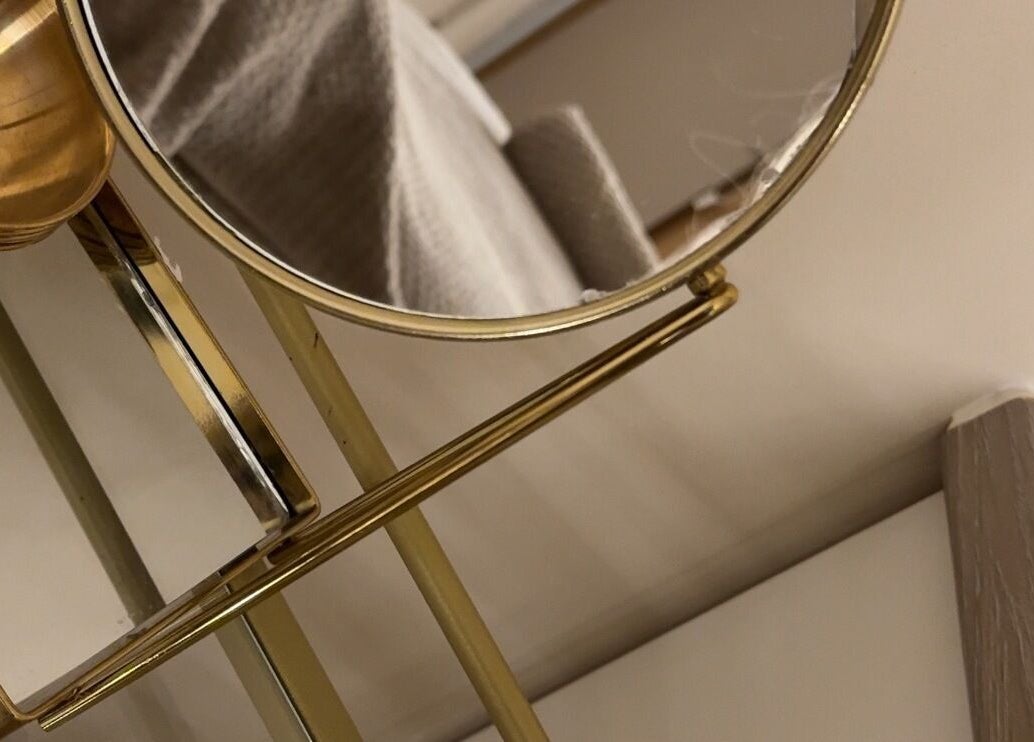 Elegant gold mirror at E Elegance & Co., Paisley, Scotland, GB, reflecting luxury and style.