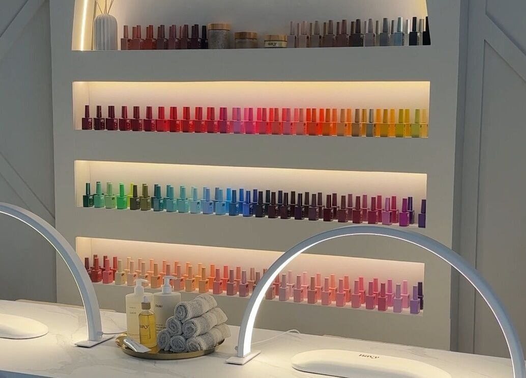 Nail polish display at E Elegance & Co., Paisley, Scotland, GB showcasing vibrant options.