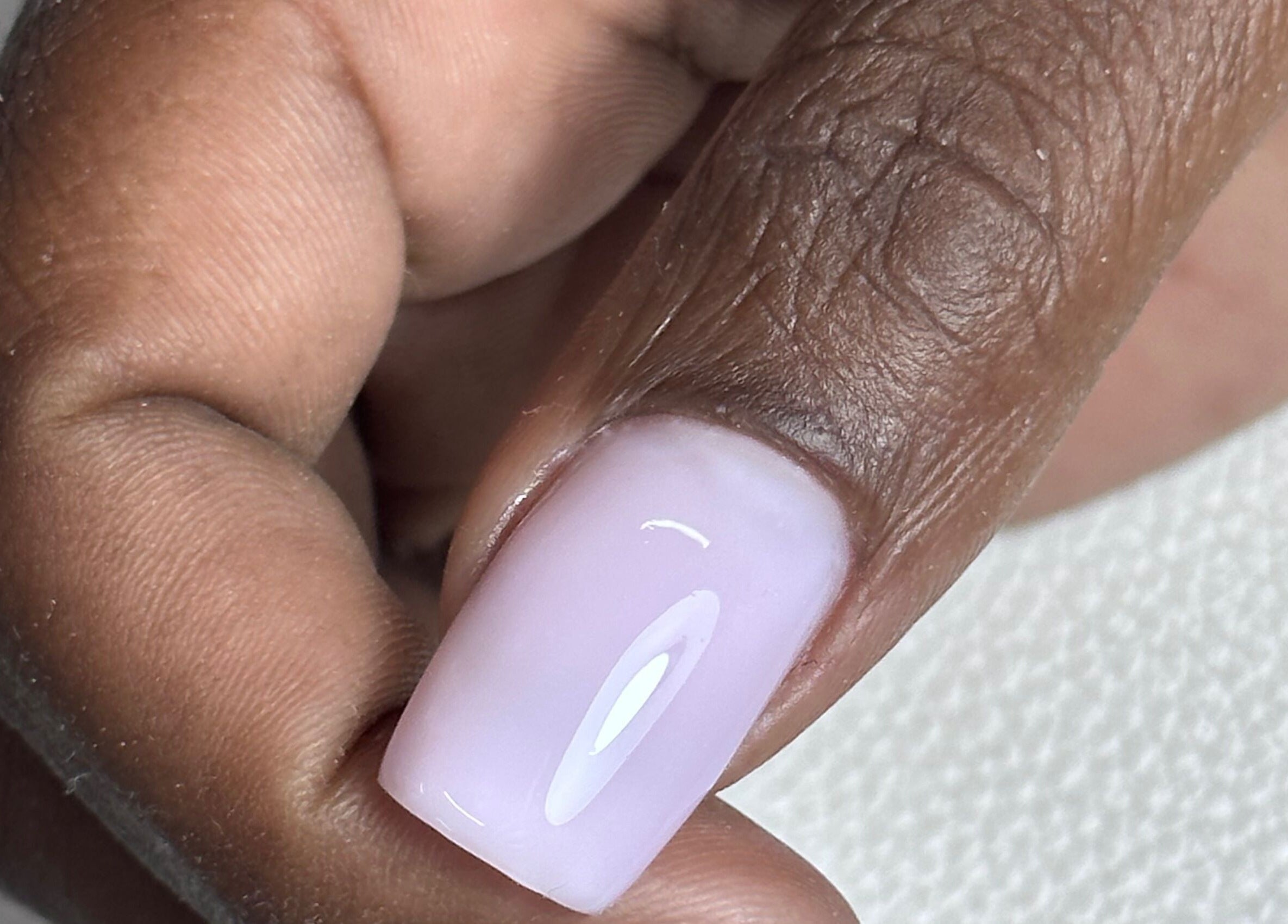 Close-up of manicured nail with pastel polish at Shine On Nails (Salon and Nail Academy), Pretoria, Gauteng, ZA.