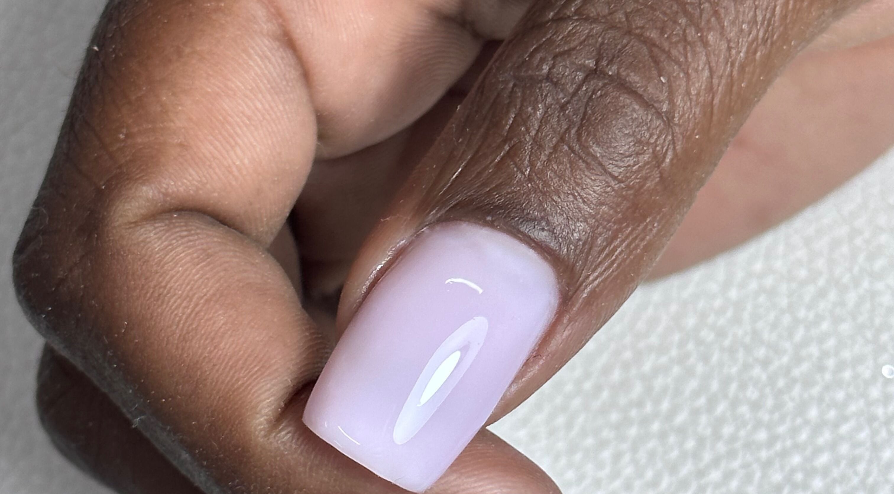 Close-up of manicured nail with pastel polish at Shine On Nails (Salon and Nail Academy), Pretoria, Gauteng, ZA.