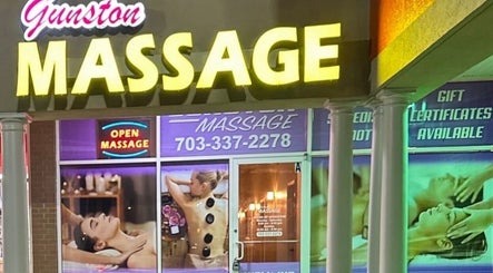 Gunston Massage storefront in Lorton, Virginia, US, displaying massage services and neon signs.