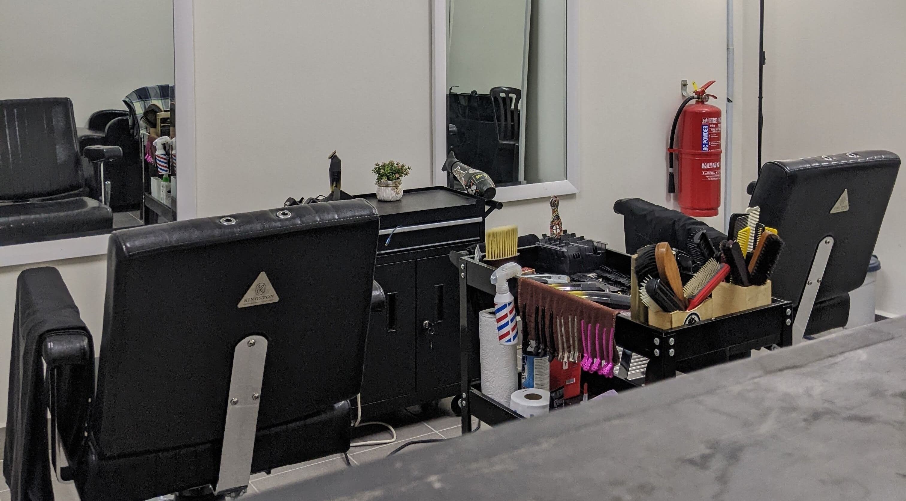 Stylish barber setup at Propercutz, Kuala Lumpur, Wilayah Persekutuan Kuala Lumpur, MY showcasing tools and chairs.