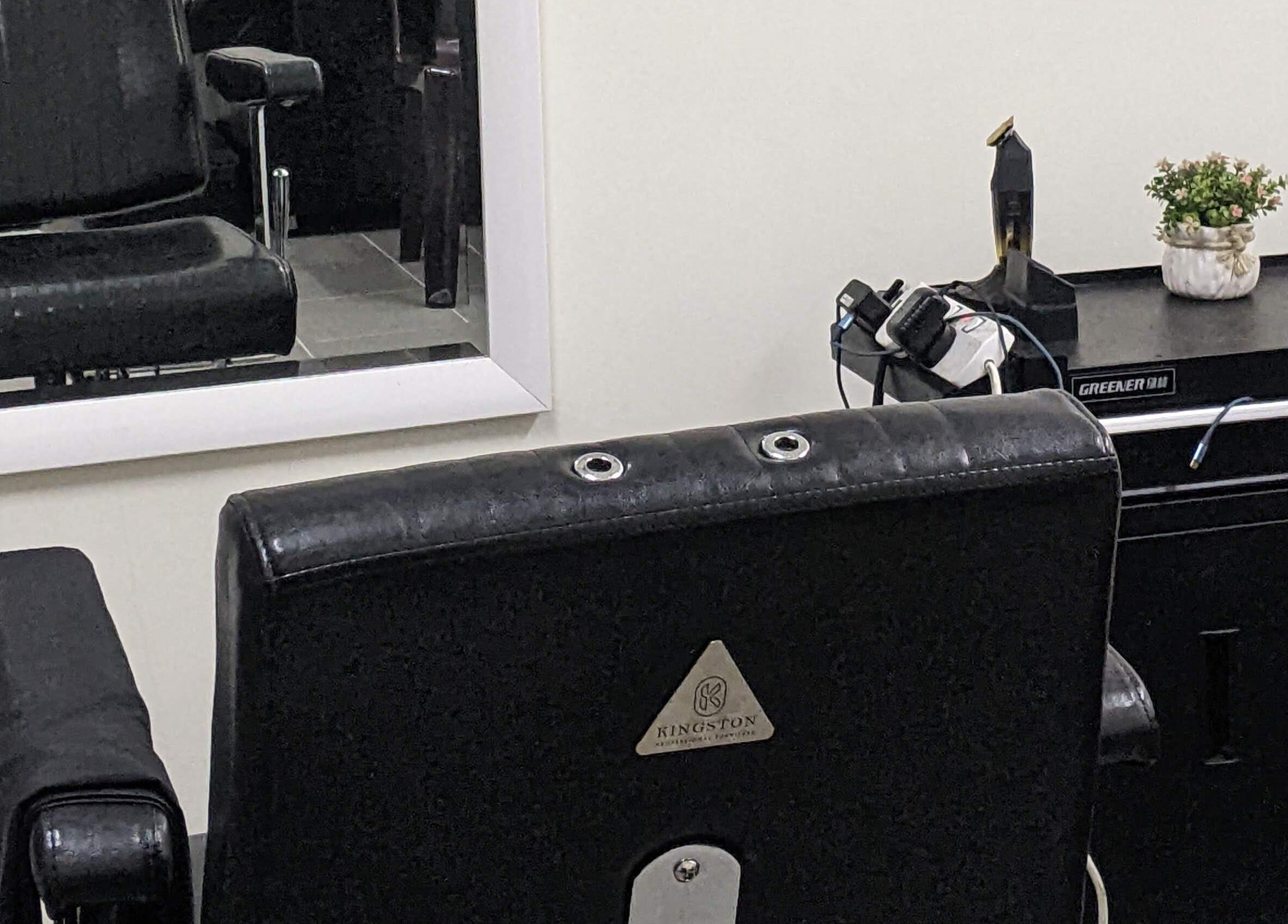 Modern salon chair and mirror setup at Propercutz, Kuala Lumpur, Wilayah Persekutuan Kuala Lumpur, MY.