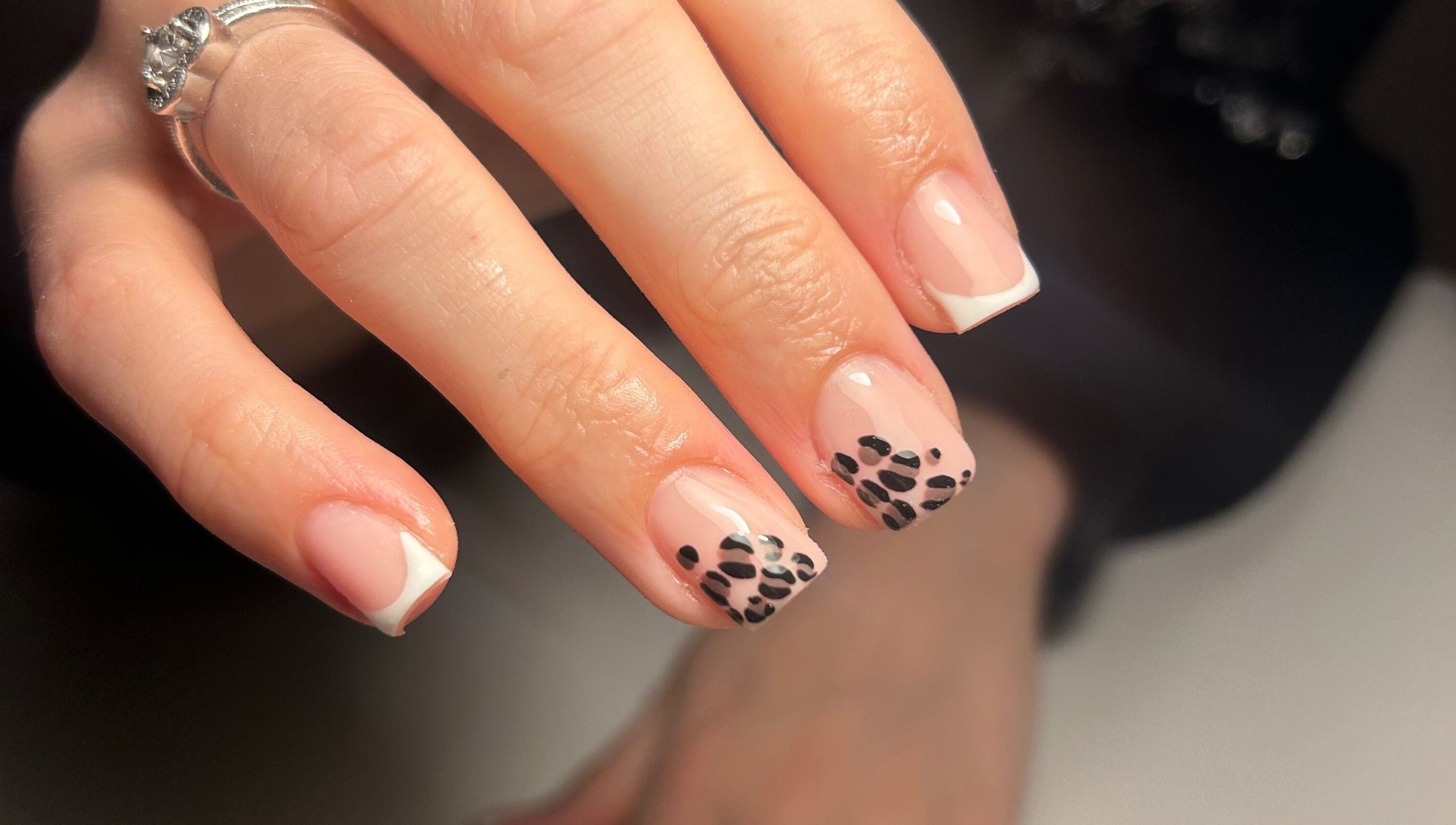 Elegant nail art design at The Beauty Q in Feering, England, GB featuring black and white patterns.