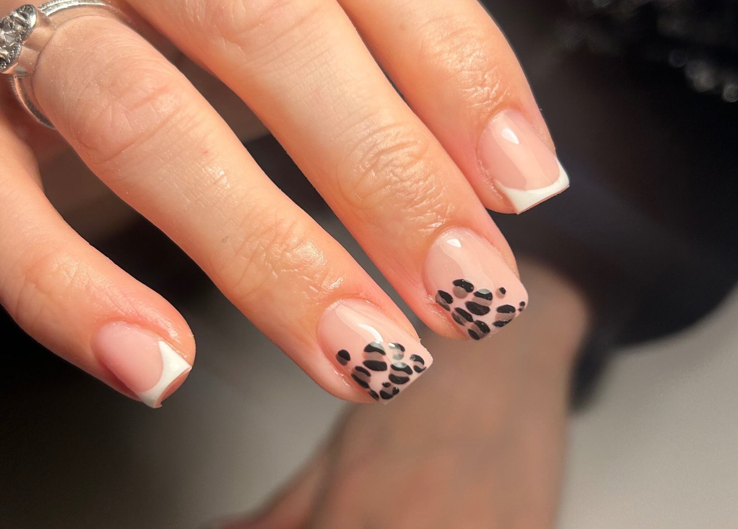 Elegant nail art design at The Beauty Q in Feering, England, GB featuring black and white patterns.