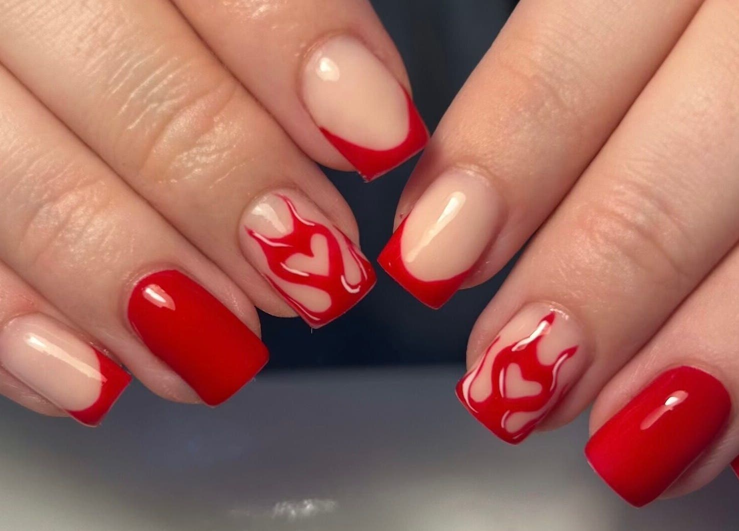 Stunning red and nude nail art design at The Beauty Q, Feering, England, GB.