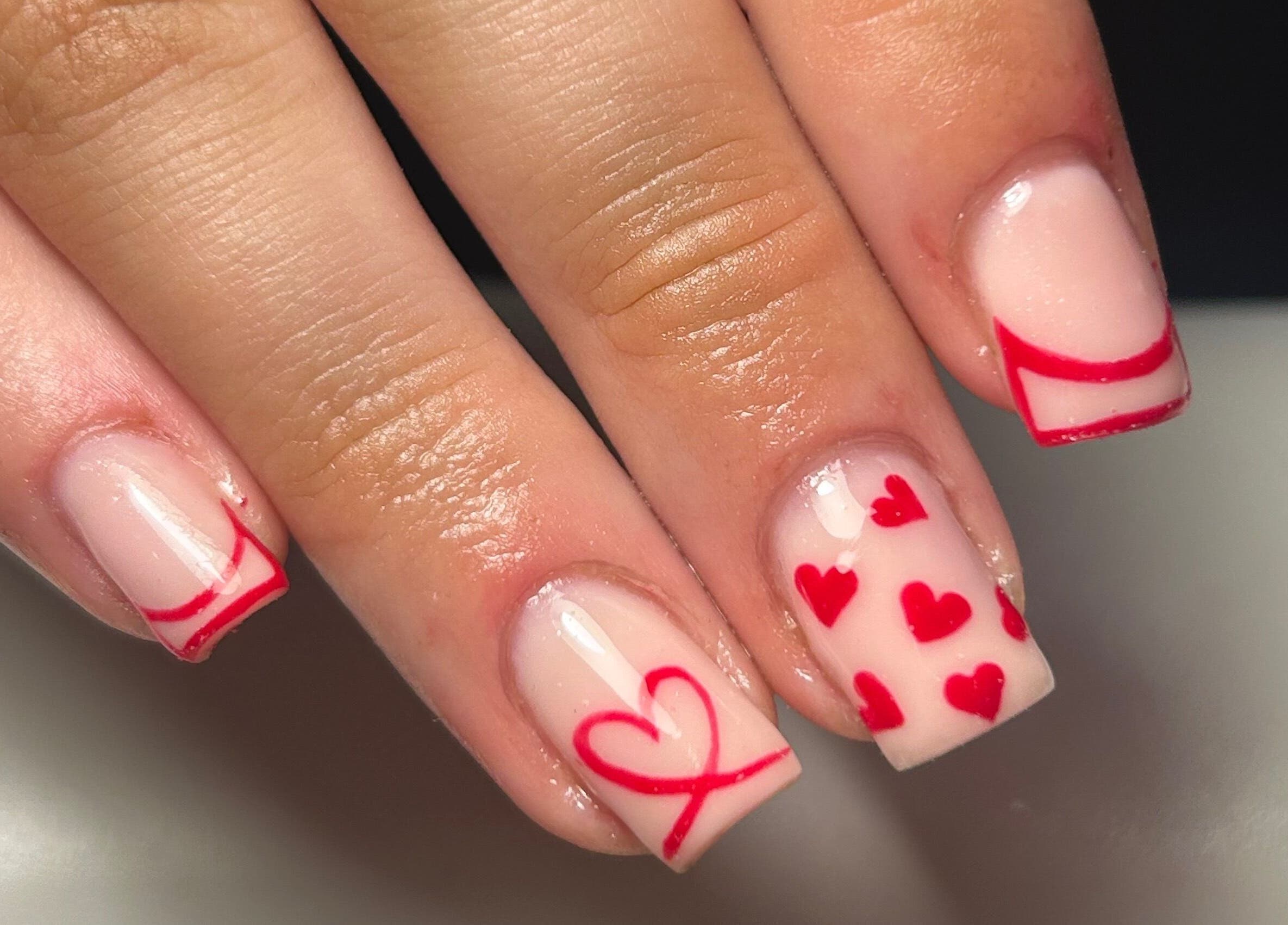 Stylish heart-themed nail art from The Beauty Q in Feering, England, GB.