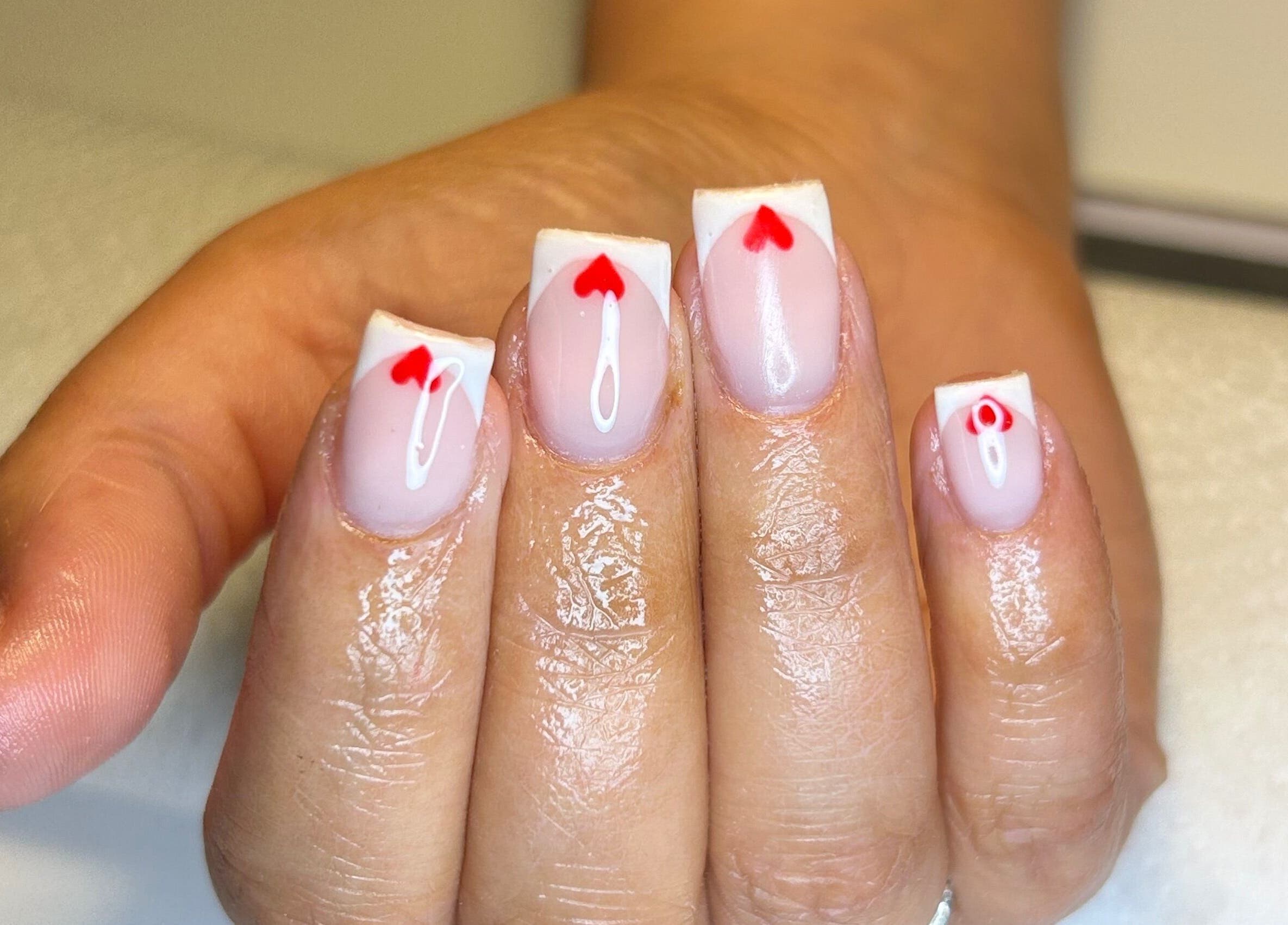 Elegant heart nail art design at The Beauty Q, Feering, England, GB.