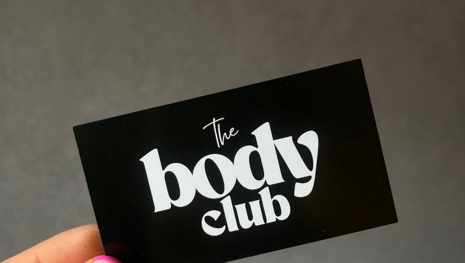 Black business card with The Body Club logo in Lisburn, Northern Ireland, GB.