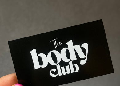 Black business card with The Body Club logo in Lisburn, Northern Ireland, GB.