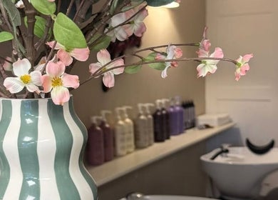 Elegant vase with flowers in Hairdressing by Alice, Rustington, England, GB, exudes serene ambiance.