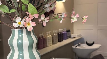 Elegant vase with flowers in Hairdressing by Alice, Rustington, England, GB, exudes serene ambiance.