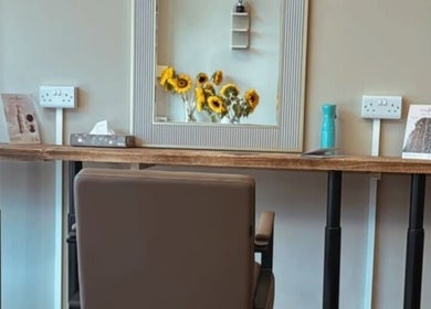 Hairdressing by Alice salon station with sunflowers in mirror, Rustington, England, GB.