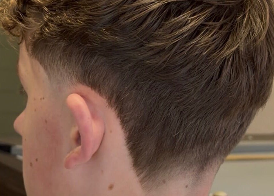 Close-up of men's undercut hairstyle at NOIR Barbering, Clarkston, Scotland, GB.