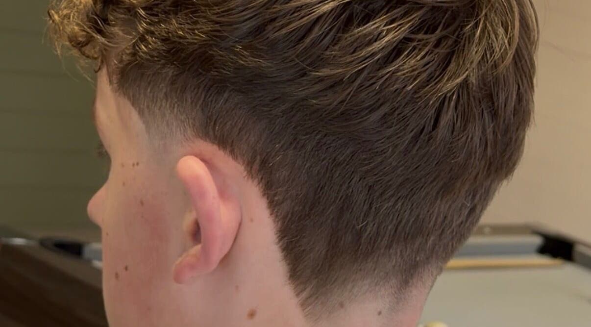 Close-up of men's undercut hairstyle at NOIR Barbering, Clarkston, Scotland, GB.
