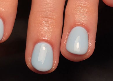 Elegant blue nails manicure at The Nail Garage in Frodsham, England, GB showcasing professional nail art.