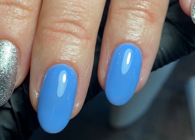 Gorgeous blue and glitter nails at The Nail Garage, Frodsham, England, GB, showcasing expert manicure.