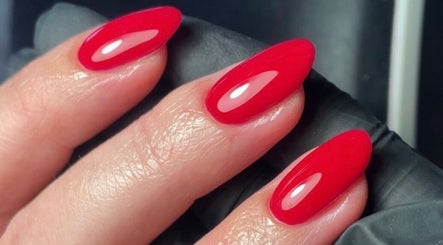 Vibrant red manicure at The Nail Garage in Frodsham, England, GB, showcasing glossy and sleek nails.