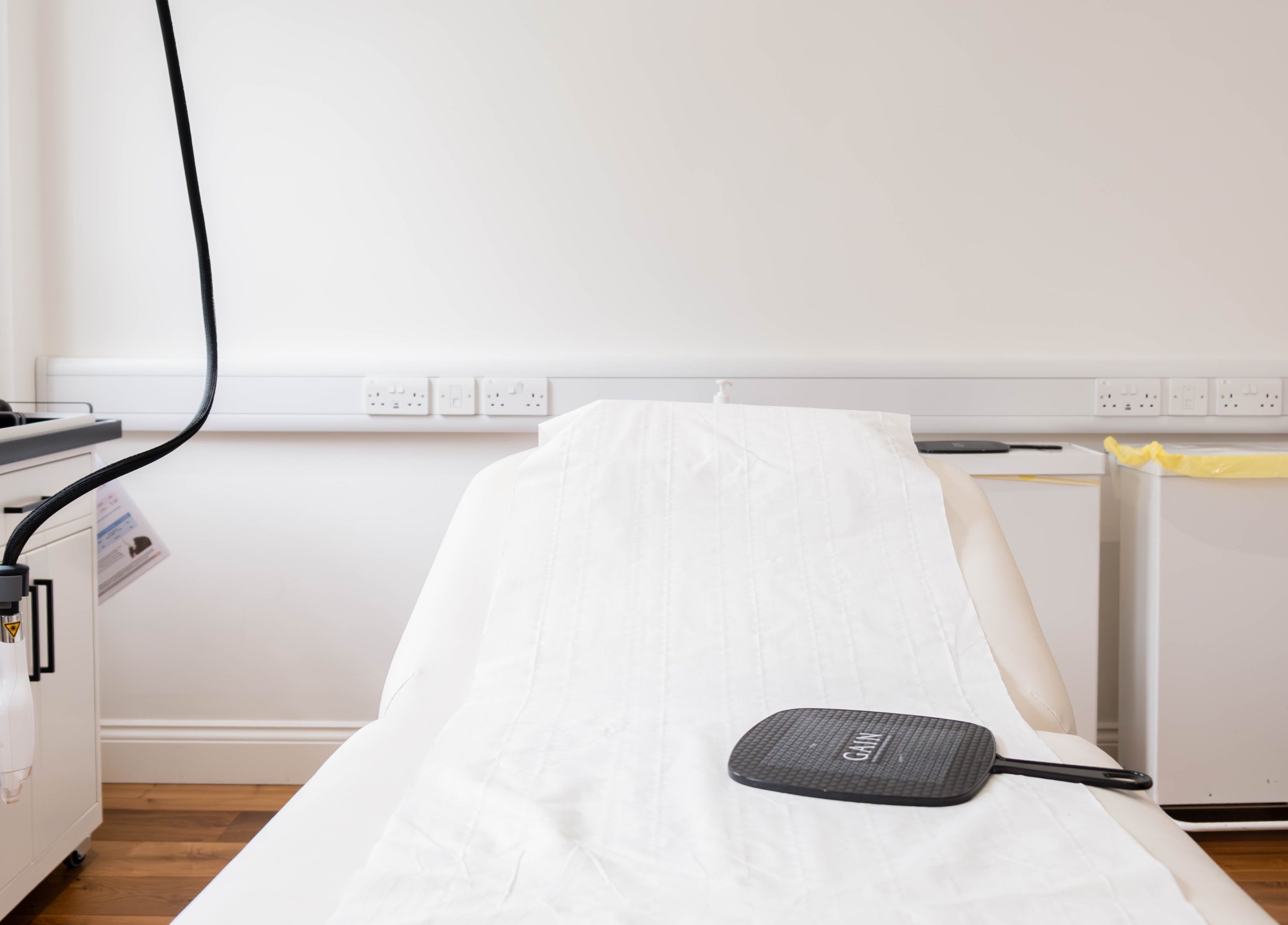 Modern treatment room at Dr Kajal Aesthetics, London, England, GB, showcasing advanced equipment and serene ambiance.