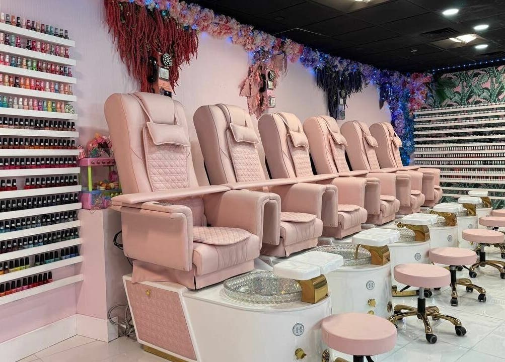 Row of luxury pink pedicure chairs at Pastel Nail Studio, South Boston, Massachusetts, US.