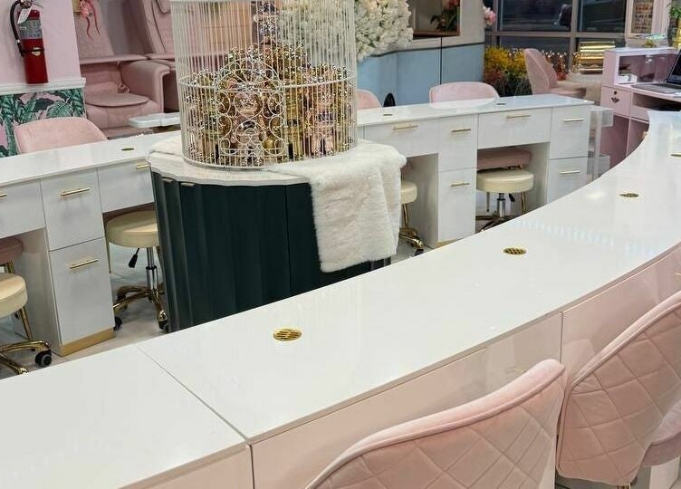 Elegant pastel interior of Pastel Nail Studio in South Boston, Massachusetts, featuring plush seating and modern decor.