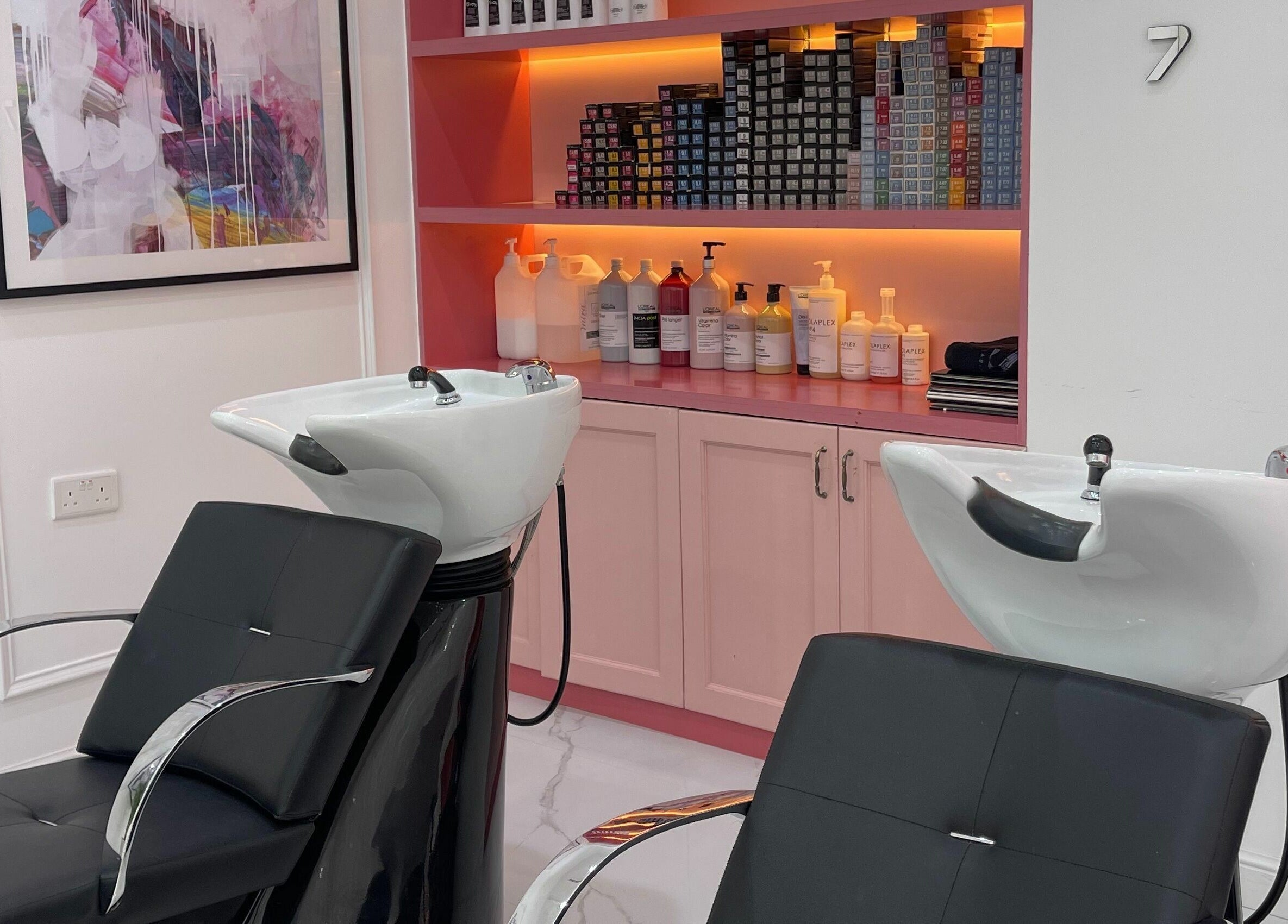 Elegant shampoo stations at Soarè Beauty Ladies Salon in Dubai, Dubai, AE, featuring modern decor and products.