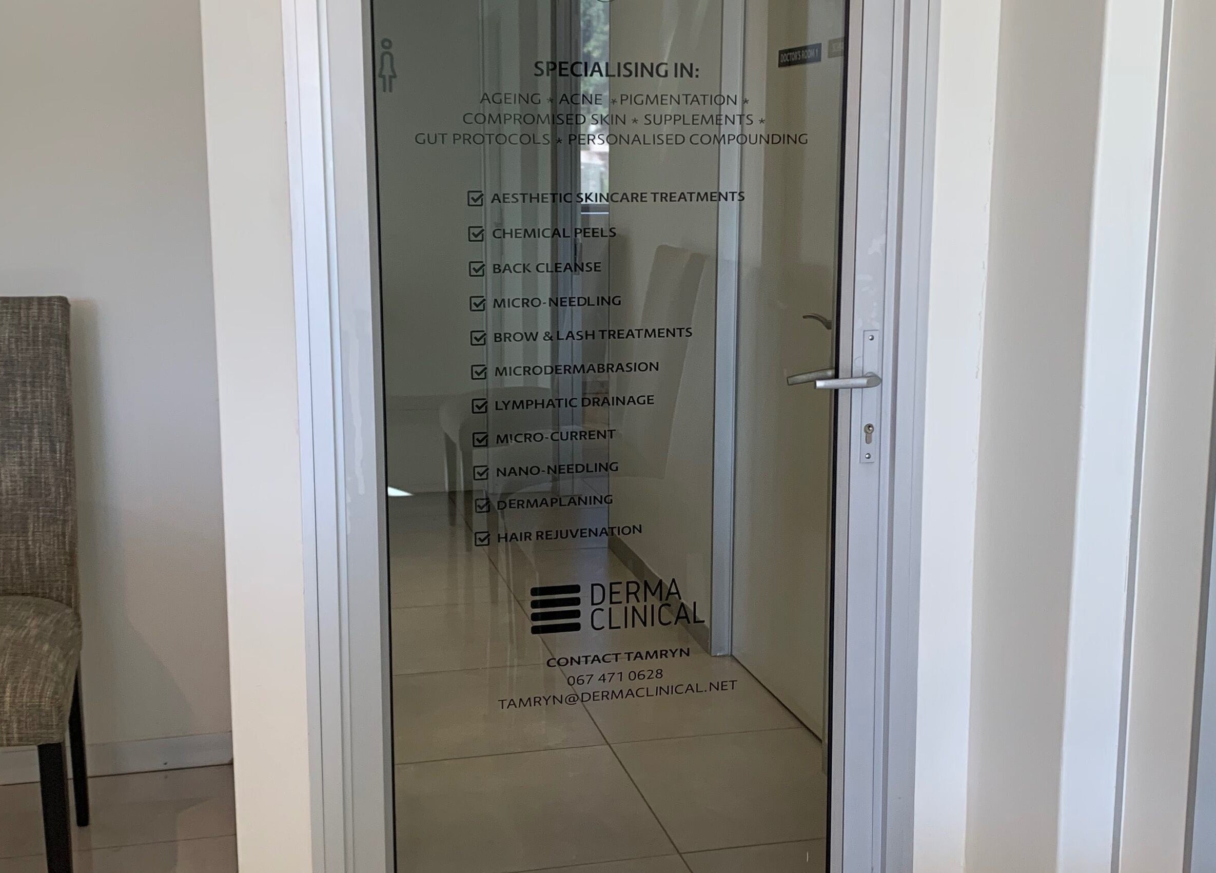 Glass door at Serene Aesthetics, Centurion, showcasing specialized skincare services. Gauteng, ZA.