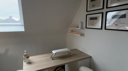 Elegant nail treatment room at bylaceycathcart, Rosyth, Scotland, GB, featuring a window and certificates.