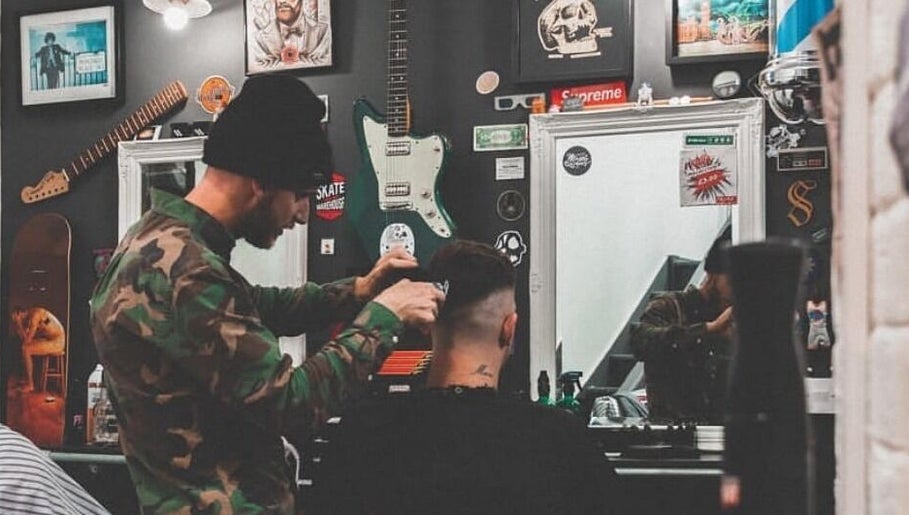 Stylist at Fazzy's Barbering Services @ HYBRID HAIR, Truro, England, GB, crafting a stylish haircut.