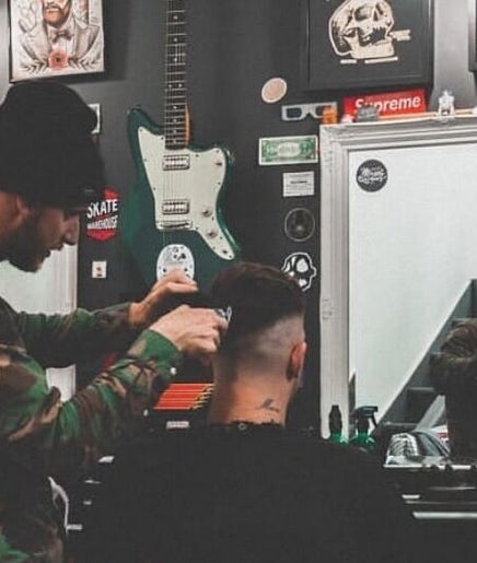 Barber styling hair at Fazzy's Barbering Services At HYBRID HAIR, Truro, England, GB.