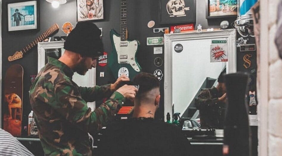 Barber styling hair at Fazzy's Barbering Services At HYBRID HAIR, Truro, England, GB.