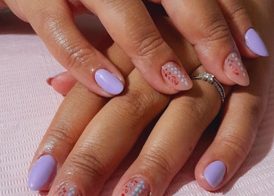 Stylish nail art with pastel purple and floral accents at Umuhle Nails in Cape Town, Western Cape, ZA.