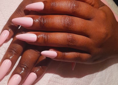 Elegant pink manicure at Umuhle Nails in Cape Town, Western Cape, ZA, showcasing glossy nail art.