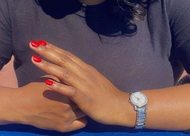 Close-up of elegant hands with red nails at Umuhle Nails, Cape Town, Western Cape, ZA.