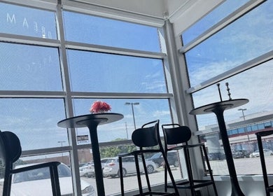 Bright, modern seating area at Lu Dream Head SPA 路梦头疗 - Warden in Markham, Ontario, CA with large windows.