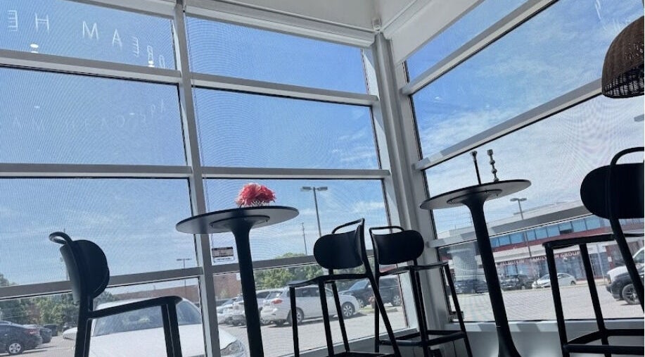 Interior of Lu Dream Head SPA 路梦头疗 - Warden in Markham, Ontario, CA with modern chairs and tables.