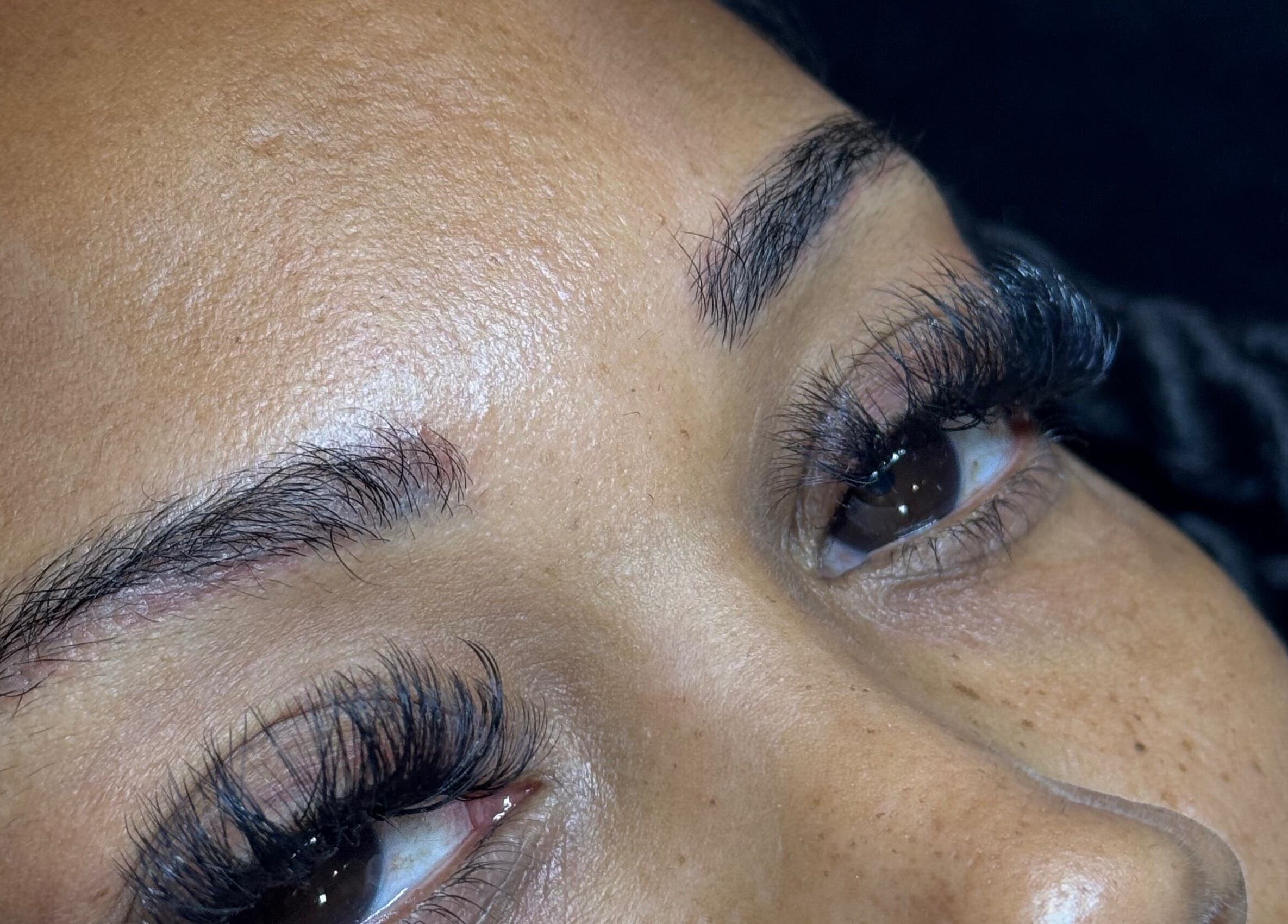 Close-up of expertly applied eyelash extensions at LZR Lashes, Edgware, England, GB, showcasing stunning volume.