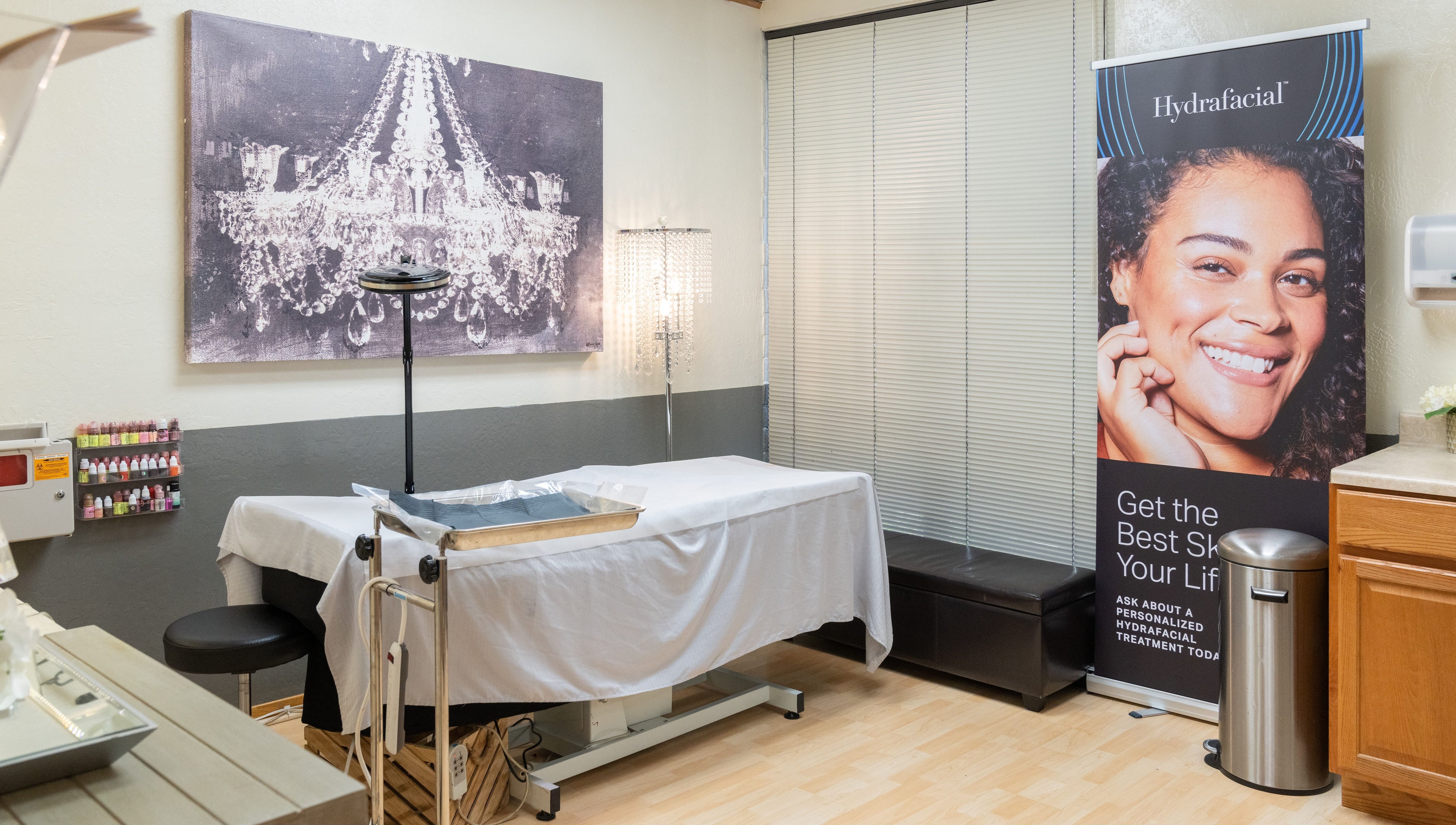 Treatment room at Ibeauty PMU and Lashes, Fremont, California, US, featuring serene decor and skincare branding.