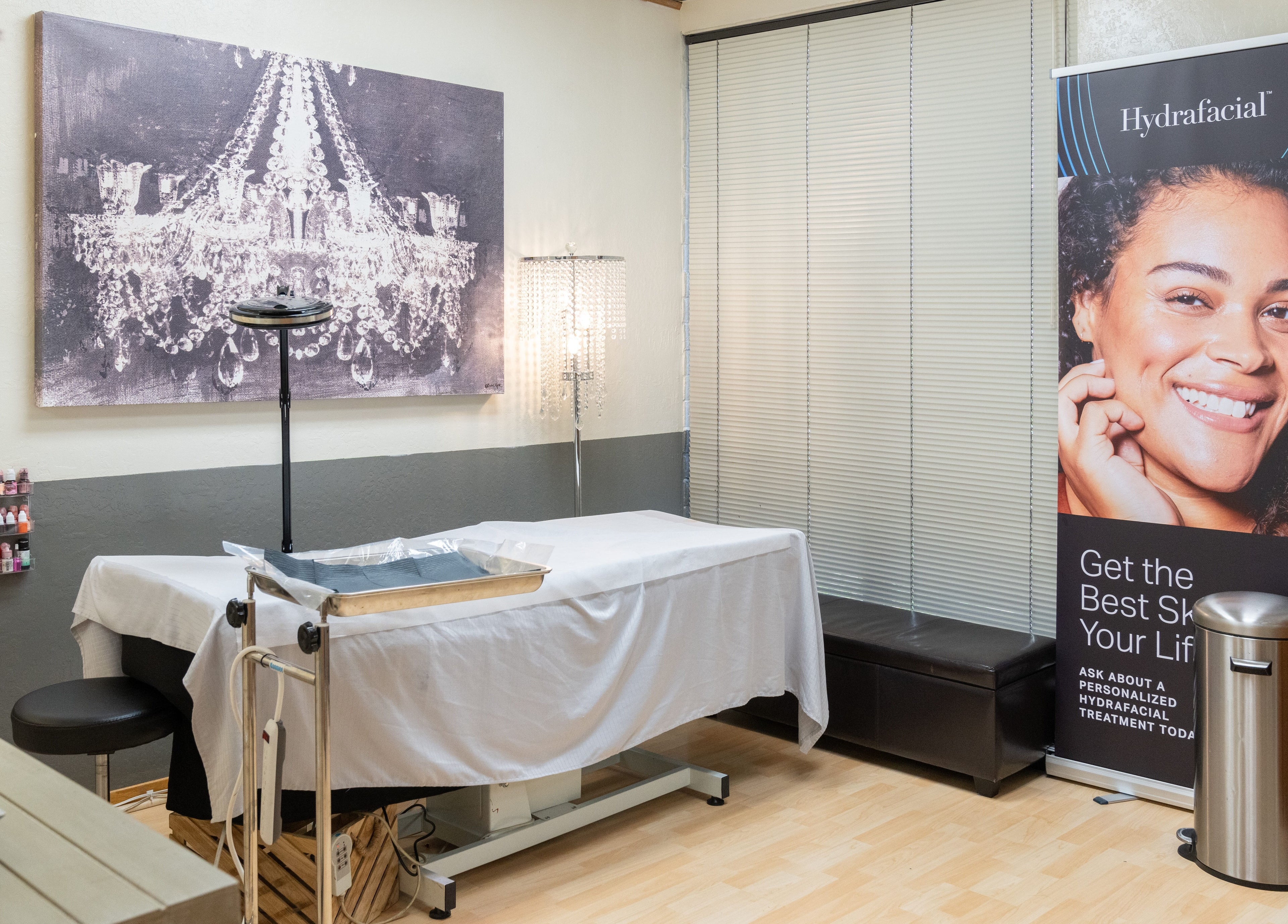 Treatment room at Ibeauty PMU and Lashes, Fremont, California, US, featuring serene decor and skincare branding.