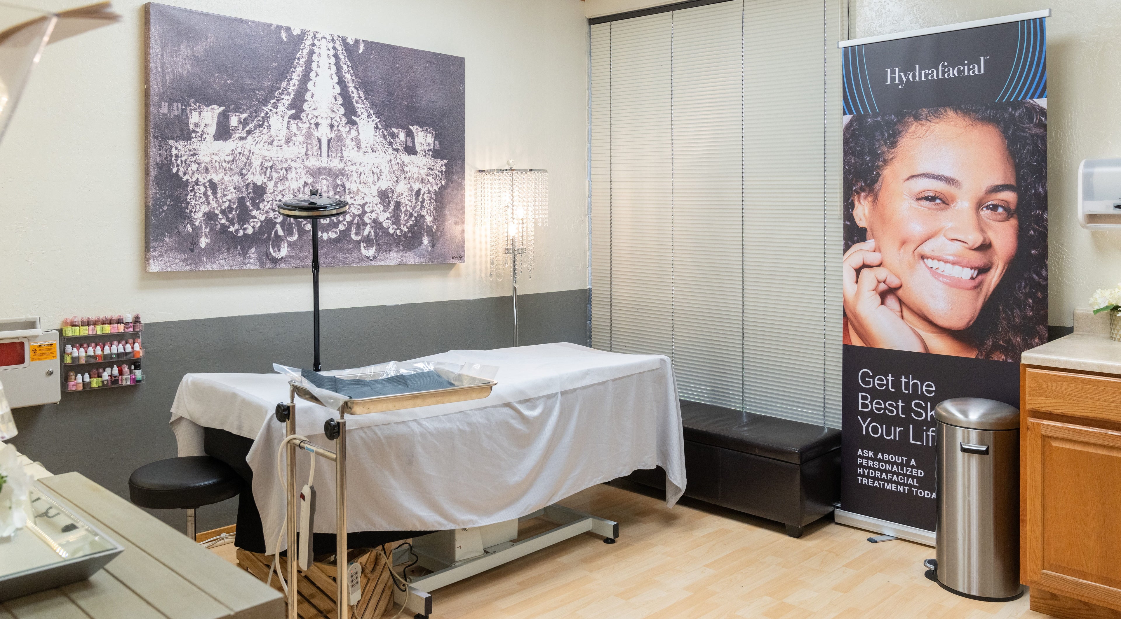 Treatment room at Ibeauty PMU and Lashes, Fremont, California, US, featuring serene decor and skincare branding.