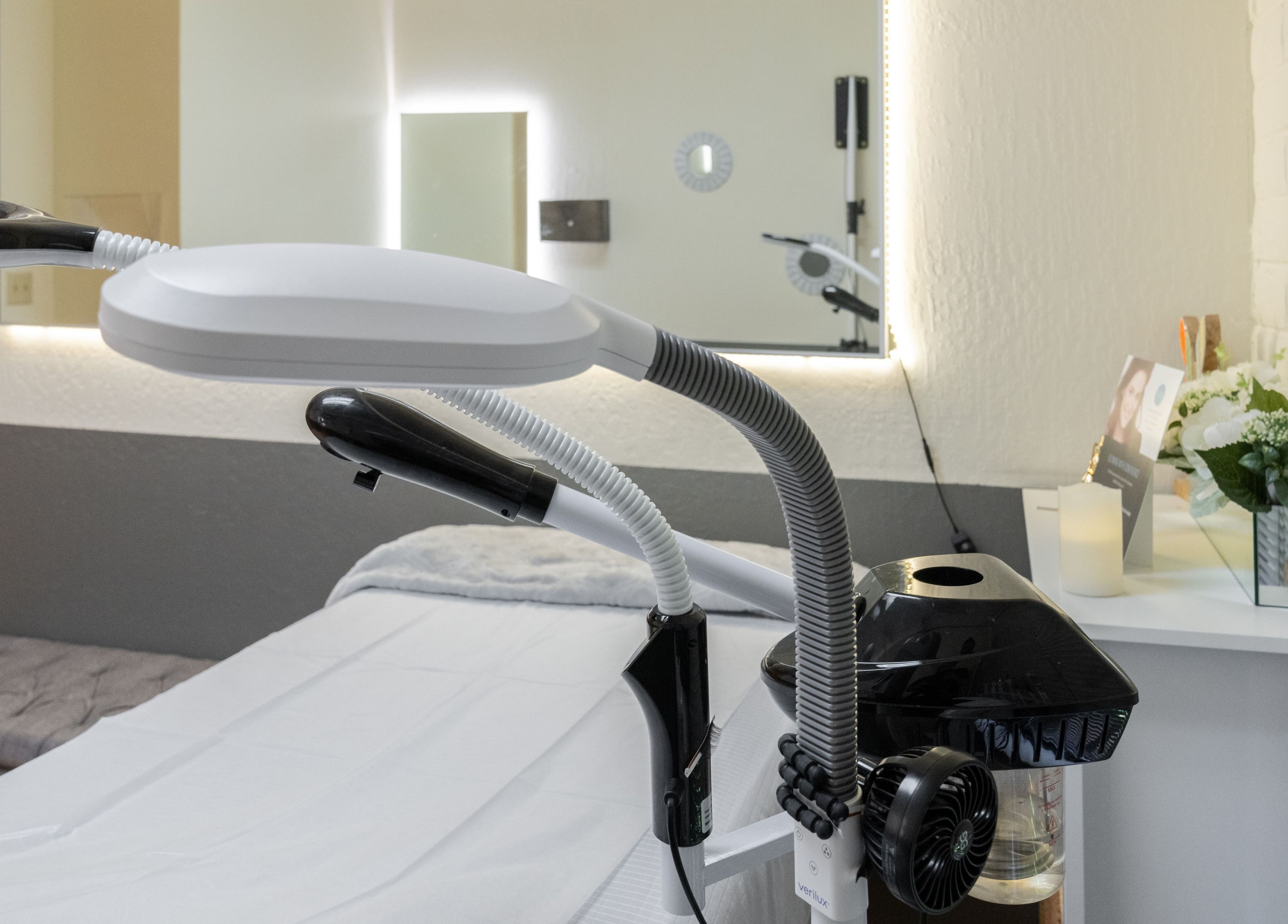 Clean treatment room at Ibeauty PMU and Lashes in Fremont, California, US, showcasing modern equipment.