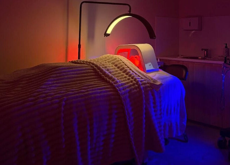 LED therapy bed at Skin By T in Campsie, New South Wales, AU, featuring a calming ambiance for relaxation.