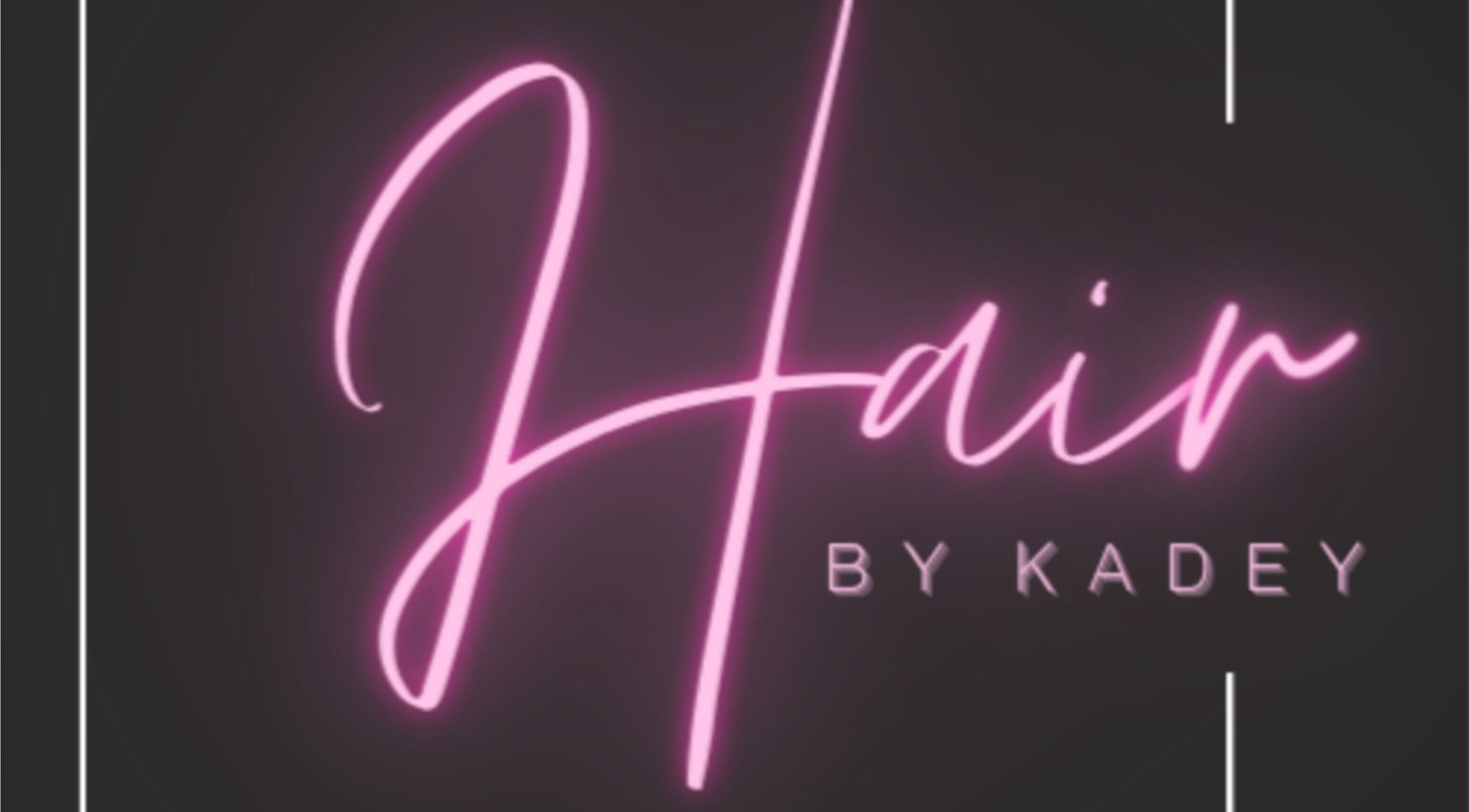 Neon sign of Hair by Kadey in Elland, England, GB, glowing in pink.