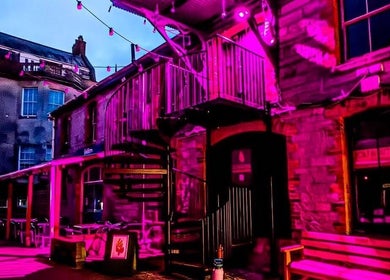 Lissybeth Hair @ Hybrid in Truro, England, GB, illuminated with vibrant purple lighting at night.