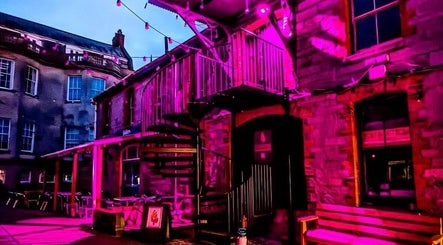 Lissybeth Hair @ Hybrid in Truro, England, GB, illuminated with vibrant purple lighting at night.